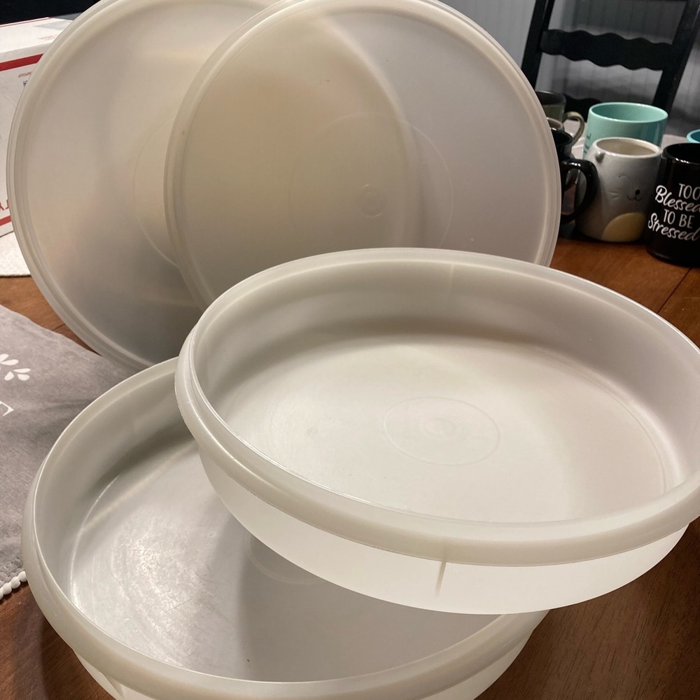 Two large round Tupperware bowls with lids